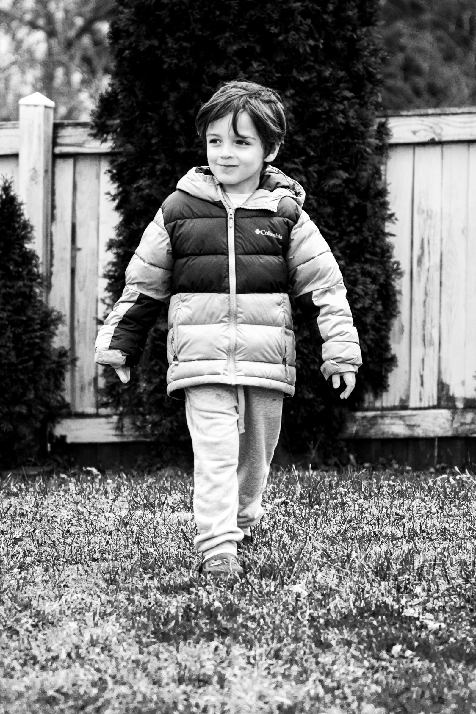He walks across the backyard